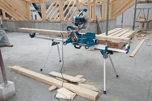 mitre saw stand holding wood