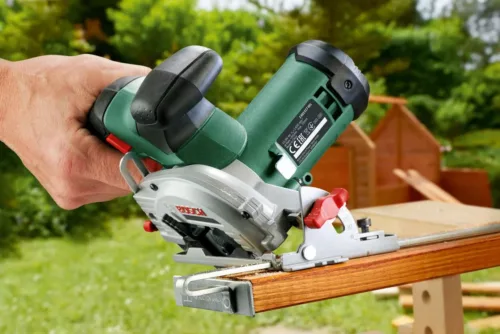 mini circular saw cutting wood