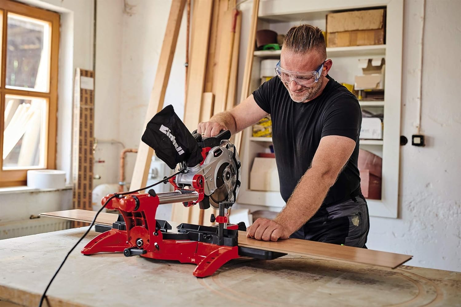 man using the Einhell dual drag crosscut mitre saw