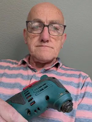 Enda holding a Parkside oscillating multi-tool