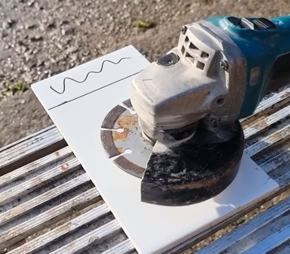 marking out a tile for cutting with an angle grinder
