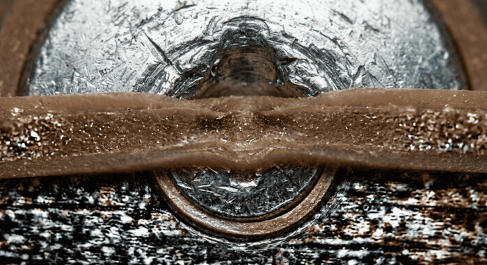 Rubber band placed over a screw head
